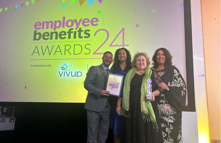 People from South Yorkshire ICB on stage at the Employee Benefits Awards 2024, collecting their award