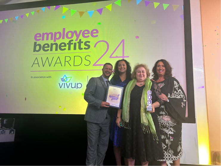 People from South Yorkshire ICB on stage at the Employee Benefits Awards 2024, collecting their award